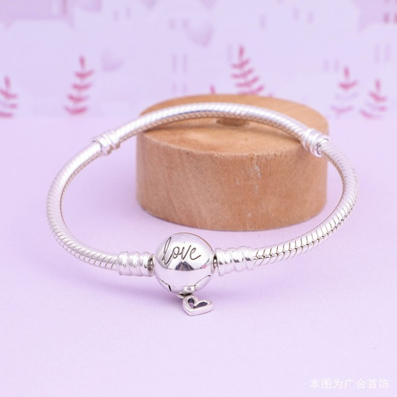 Elegant Love Snake Chain Bracelet displayed on a wooden stand, showcasing its silver finish and romantic 'Love' charm.