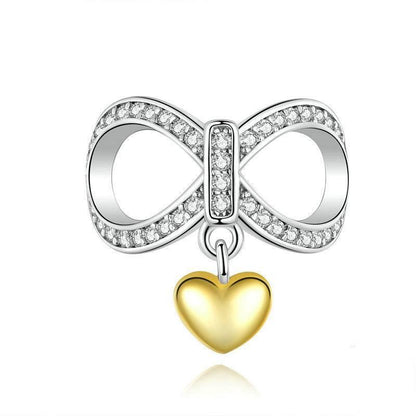 Heart infinity charm with a silver infinity symbol encrusted with crystals and a dangling gold heart, perfect for jewelry customization.