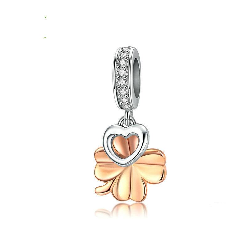 Gold four leaf clover charm with sparkling accents