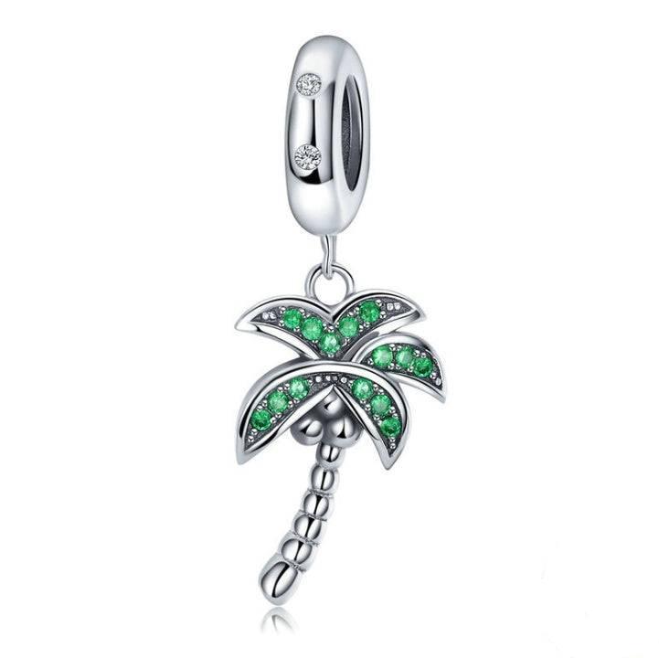 Sterling silver coconut tree charm with green accents.