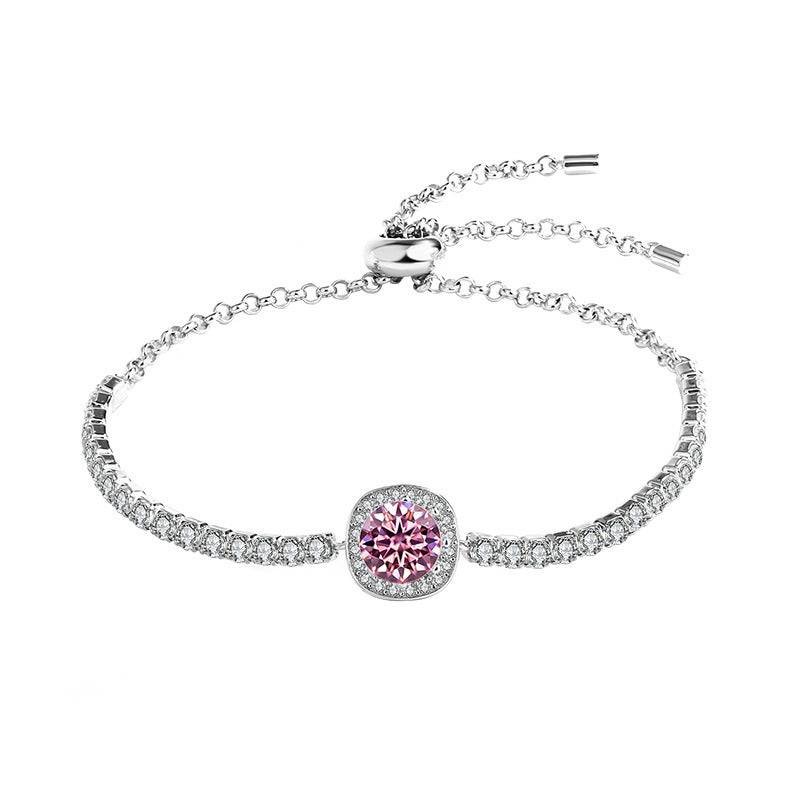 Silver moissanite galaxy bracelet with a pink central stone, featuring a celestial-inspired design and adjustable chain.