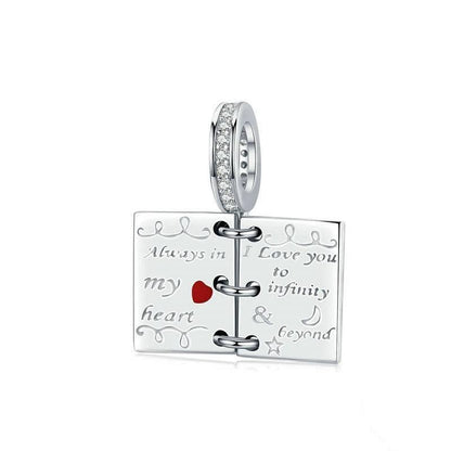 Sterling silver love notes charm with engraved romantic messages.