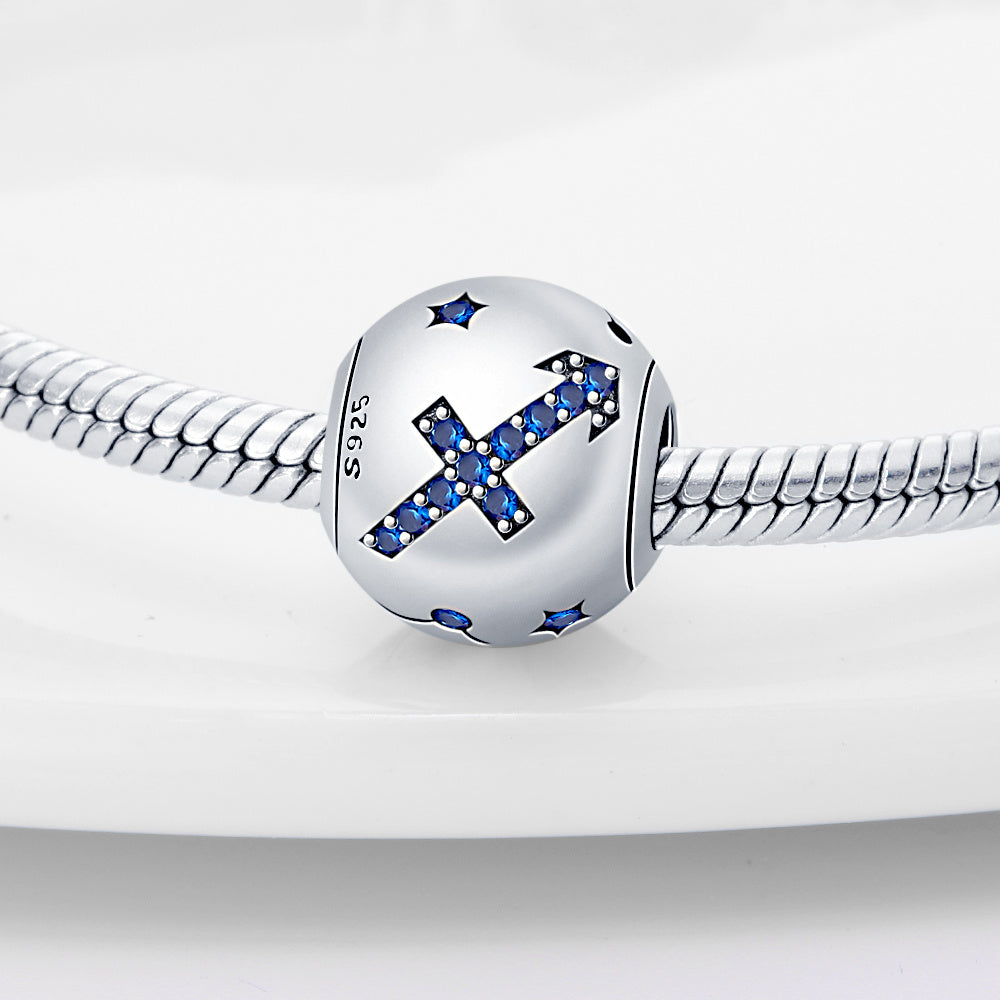 Sagittarius zodiac charm in sterling silver with blue crystal accents, perfect for enhancing personalized jewelry collections.