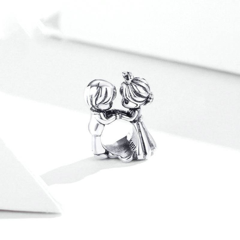 Close-up of silver couple charm