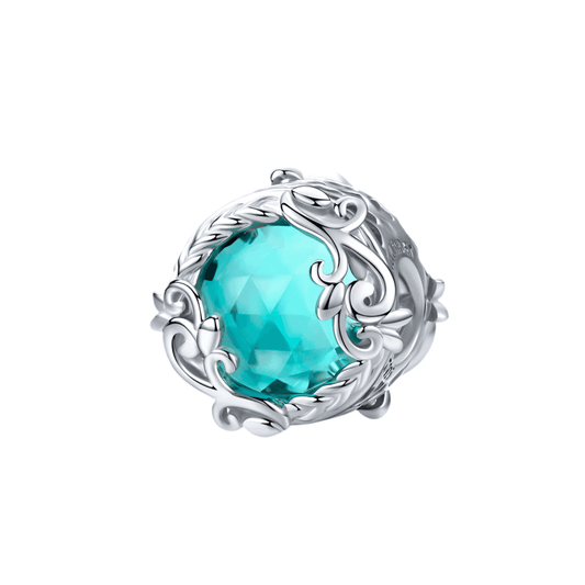 Elegant Aqua Glass Charm with intricate silver detailing, featuring a faceted aqua gemstone for a sophisticated jewelry accent.