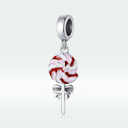 Colorful lollipop charm with red and white swirls