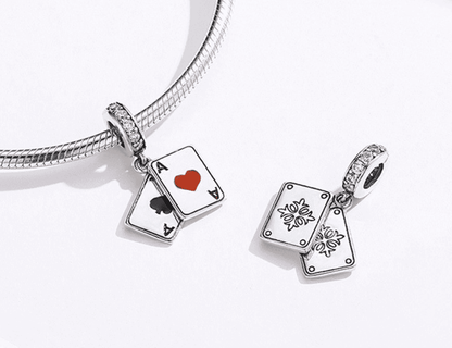 Close-up of playing cards charms with intricate design