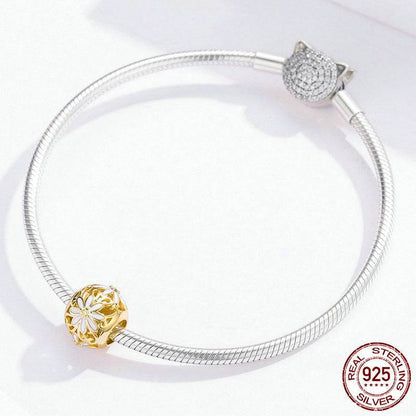 Silver bracelet featuring Gold Daisy Charm