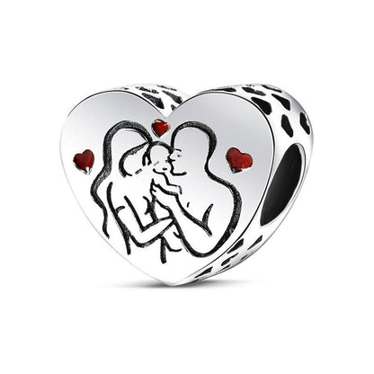 Heart charm with family illustration and red hearts