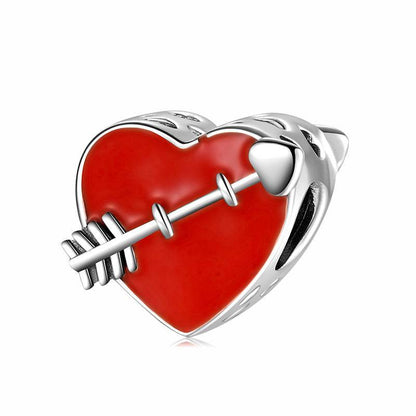 Red heart charm with arrow design