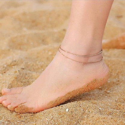 Anklet on foot in sand