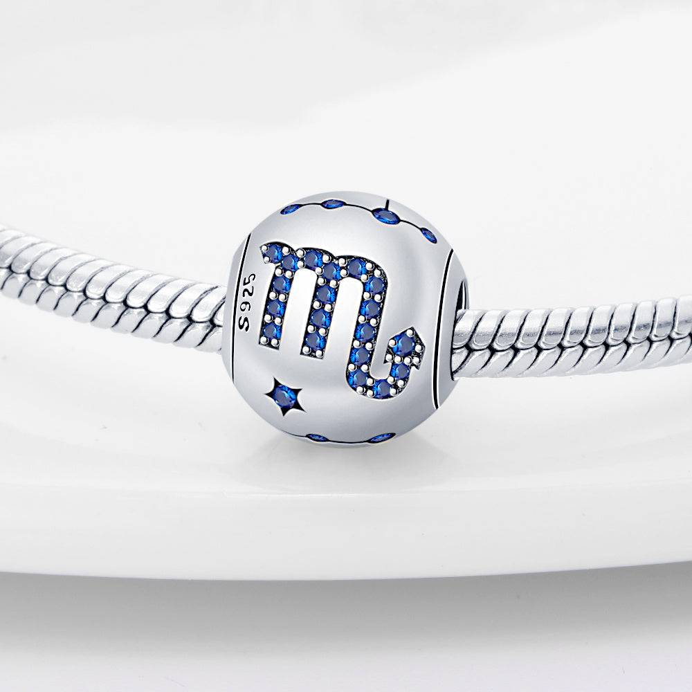 Scorpio zodiac charm in sterling silver with blue crystal accents, designed for stylish and meaningful jewelry personalization.