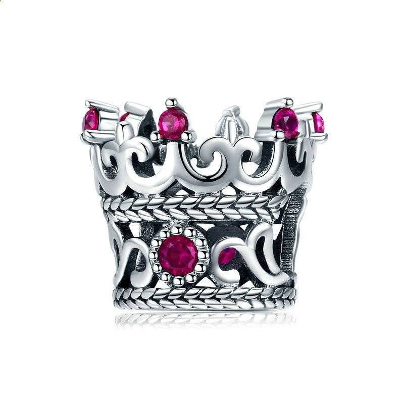 Elegant crown charm with red gemstones