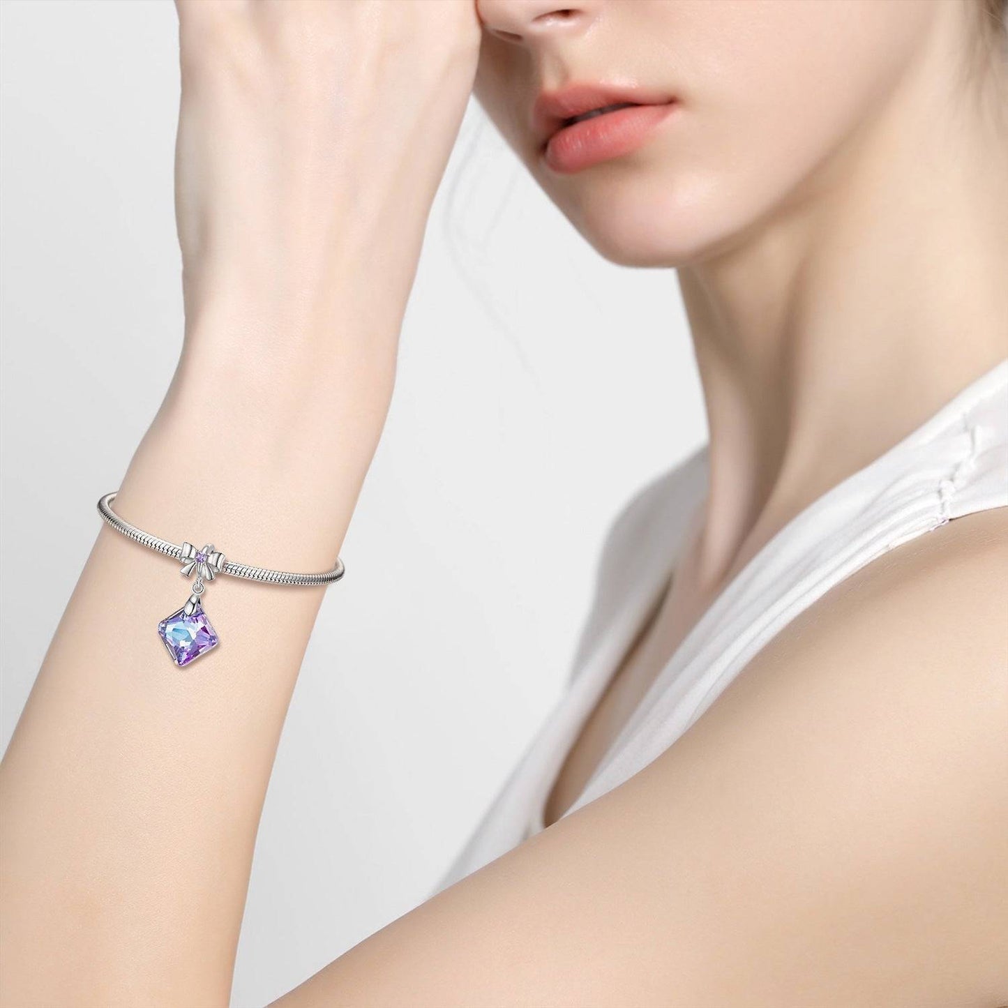 Woman wearing bracelet with Crystal Bow Charm