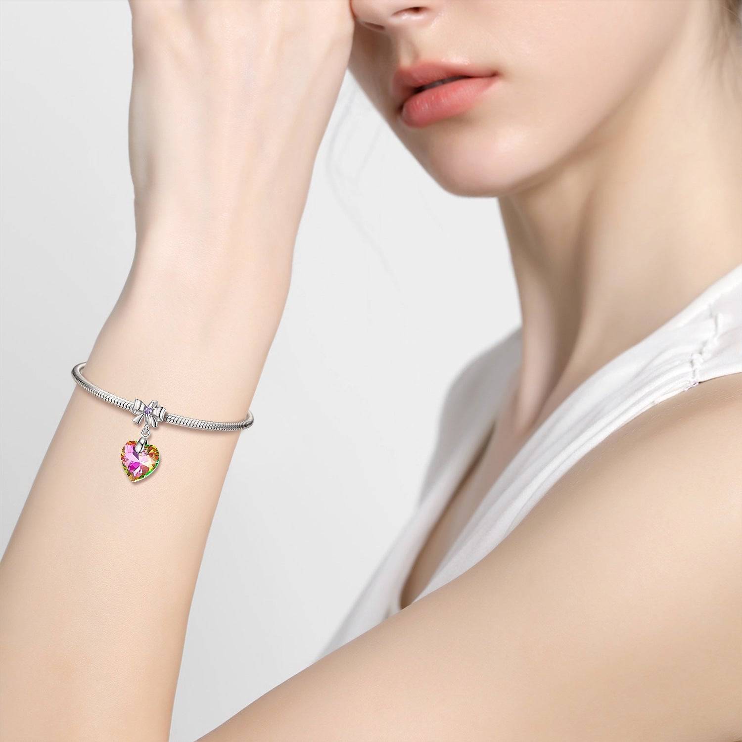 Woman wearing bracelet with crystal heart charm