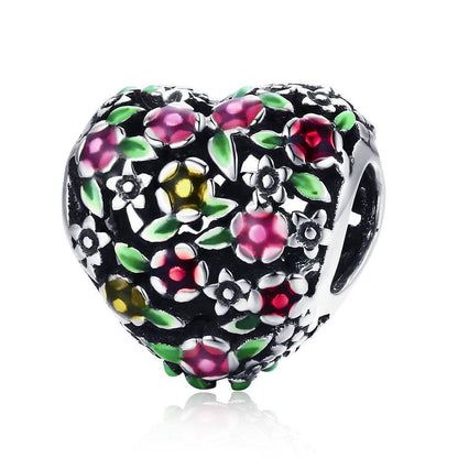 Heart charm with colorful floral design